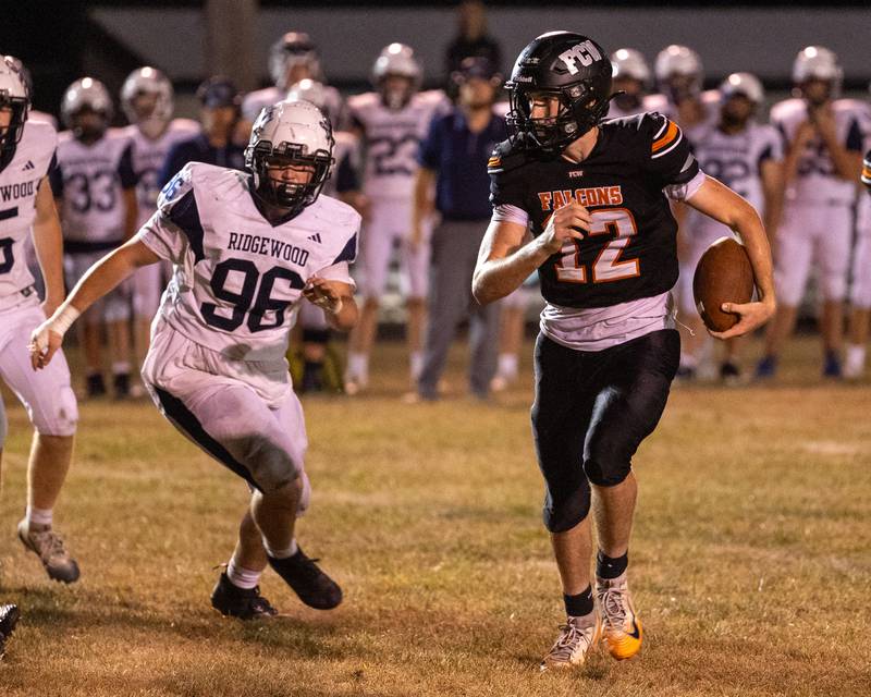 Logan Ruddy (12) of FCW runs ball whilst being chased by Tyler Bethel (96) of Ridgewood on Friday, Sept. 26, 2025, at Woodland School in rural Streator.