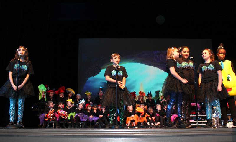 Mersisters, left to right, Aquata (Ava Jacobs), Adella (Kaelynn Johnson), Arista (Oliviah Friedrich), Atina (Tezia Webster) and April (Scarlet Lesak) along with Flounder (Alaysia Hunter, far right) sing "She's in Love" during the Streator Elementary Schools production of "The Little Mermaid Jr." Friday, May 5, 2023, at the Streator High School Auditorium.