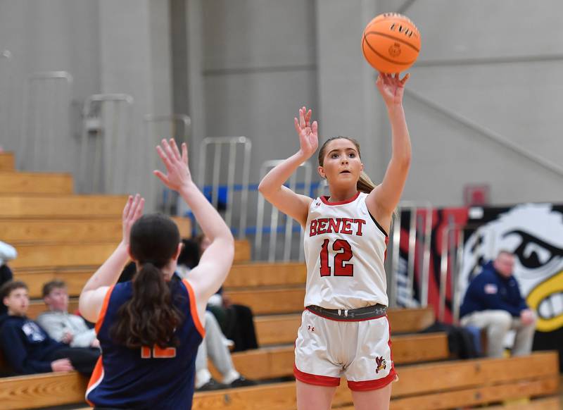 Benet’s Lindsay Harzich (12) shoots a three pointer during the Class 4A Benet Regional championship game against Naperville North on February 20, 2025 at Benet Academy in Lisle.