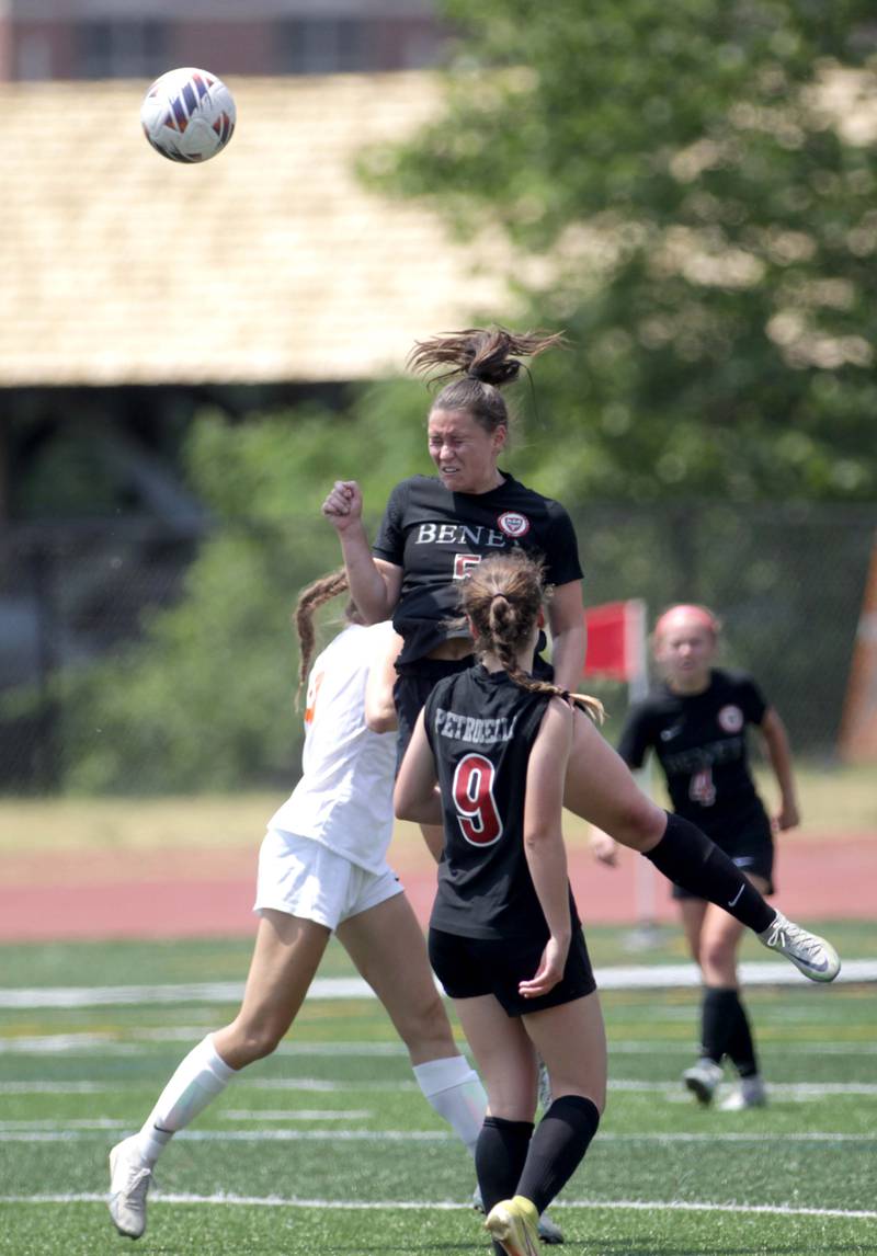 Benet’s Reese MacDonald heads the ball during a Class 2A girls state soccer semifinal against Crystal Lake Central at North Central College in Naperville on Friday, June 2, 2023.