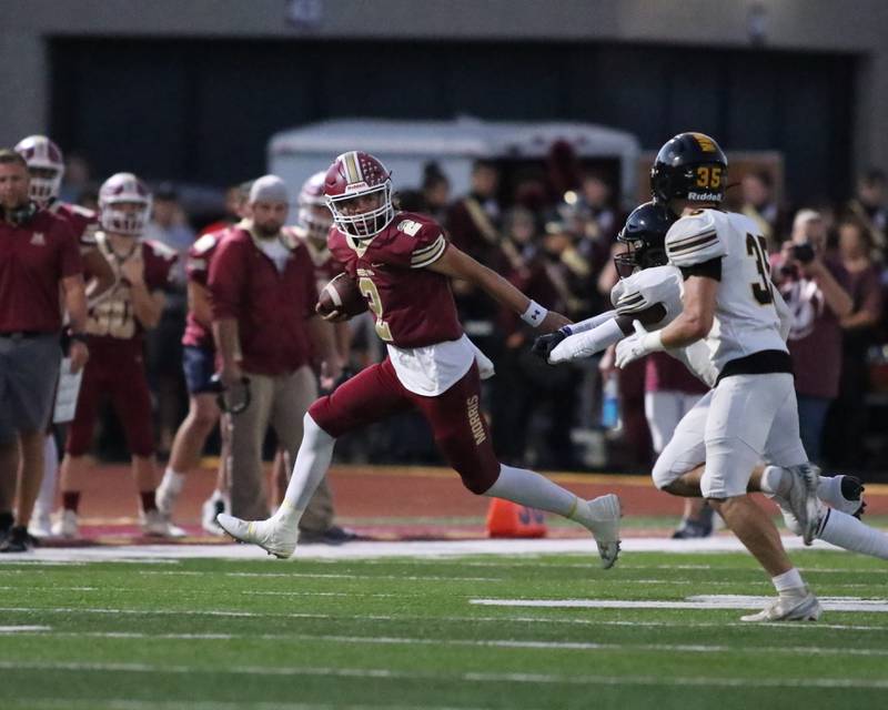 Morris Carter Button (2) runs down the sidelines after  reception during football game between Joliet West at Morris.  Sept 1, 2023.