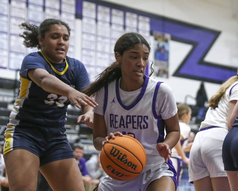 Plano's Jailyn Brown (10) dribbles from underneath the basket during their basketball game between Yorkville Christian at Plano Wednesday, Jan 07, 2026 in Plano.