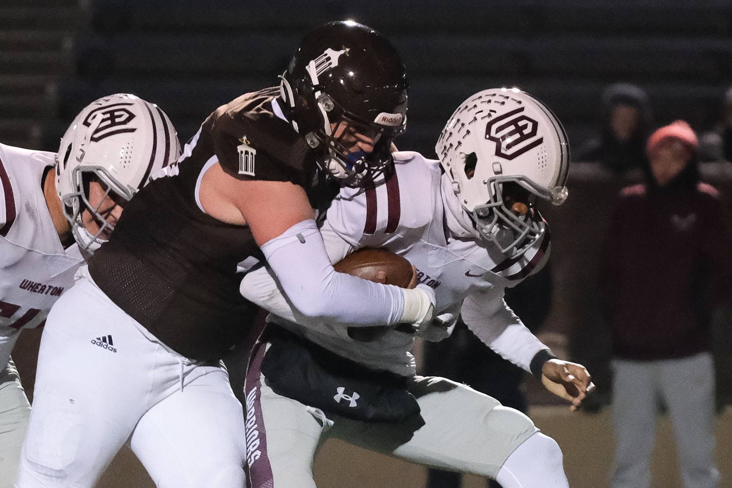 Joliet Catholic's Billy Burke sacks Wheaton Academy's Belay Brummel in the 2nd round playoffs in Joliet on Friday, Nov. 5, 2021.