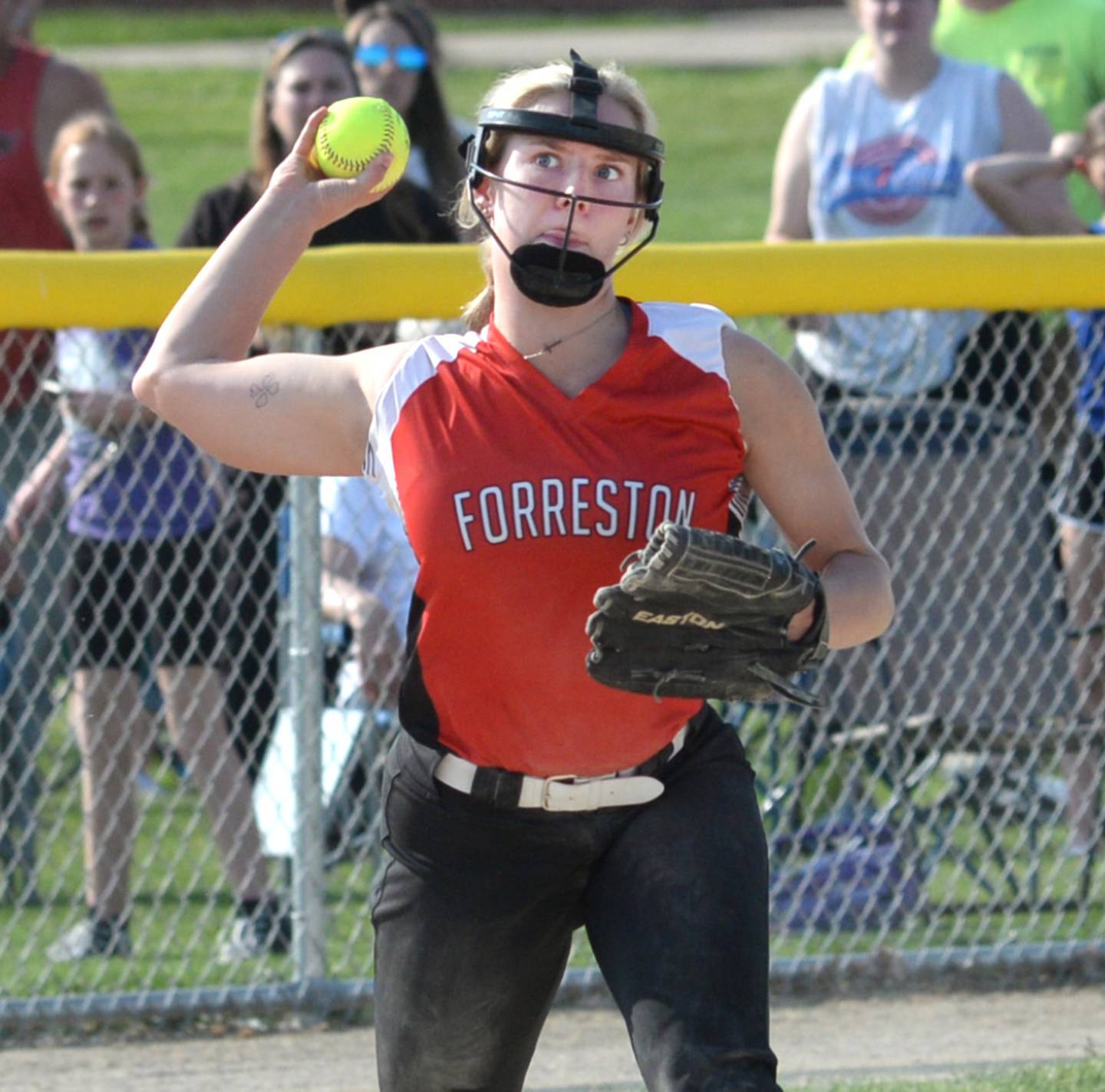 Forreston third baseman Rylee Broshous looks at an Orangeville runner before throwing to first for an out during the 1A Forreston Sectional against Orangeville on Tuesday, May 23.