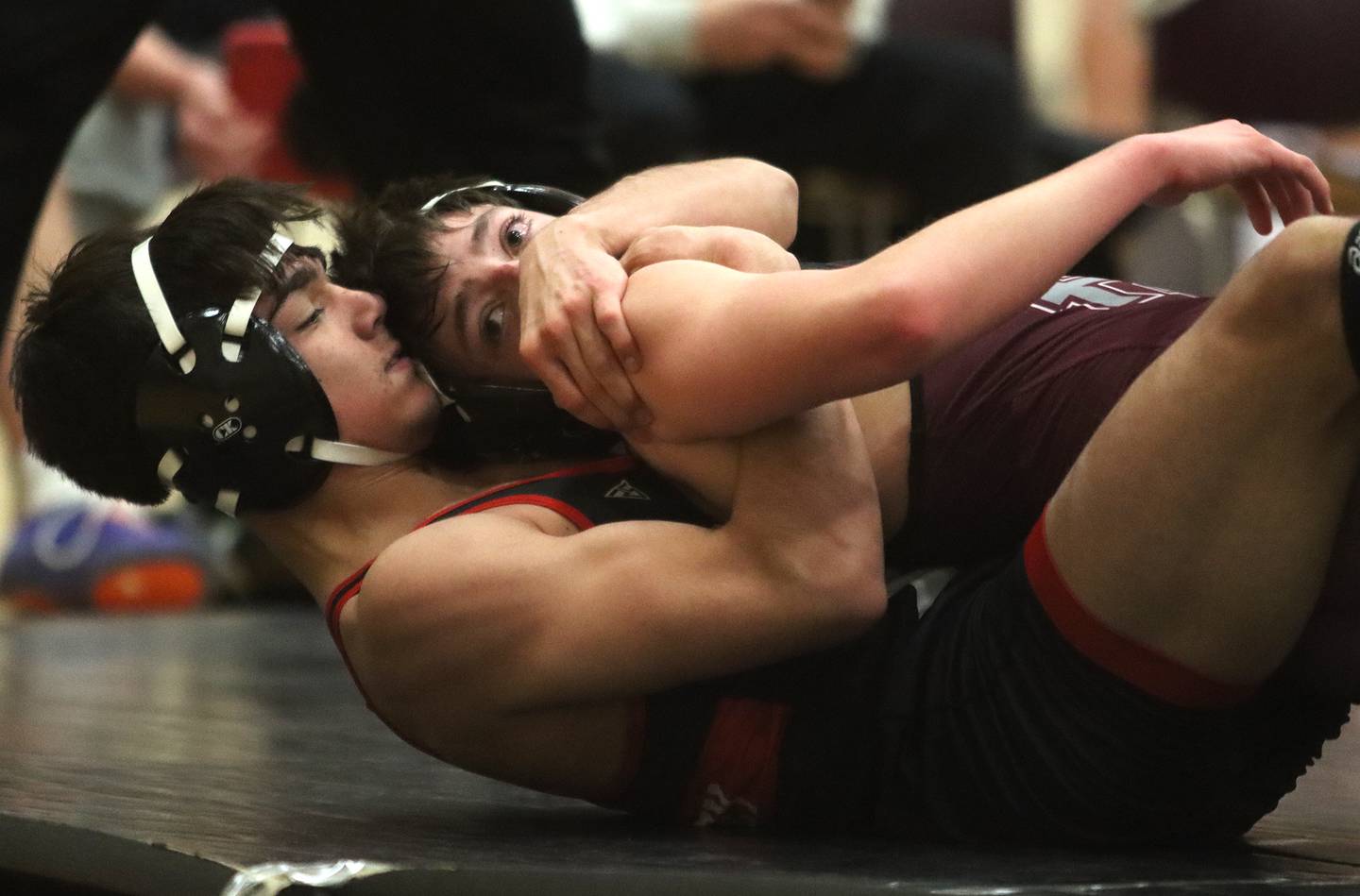 Huntley’s Alex Gutierrez, bottom, battles Prairie Ridge’s Zo Massart at 132 pounds in varsity wrestling on Thursday, Jan. 23, 2025, at Huntley High School in Huntley.