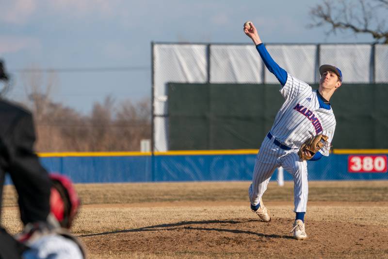 Marmion’s Matthew Carlson (16) delivers a pitch against Yorkville during a baseball game at Marmion High School in Aurora on Tuesday, Mar 28, 2023.