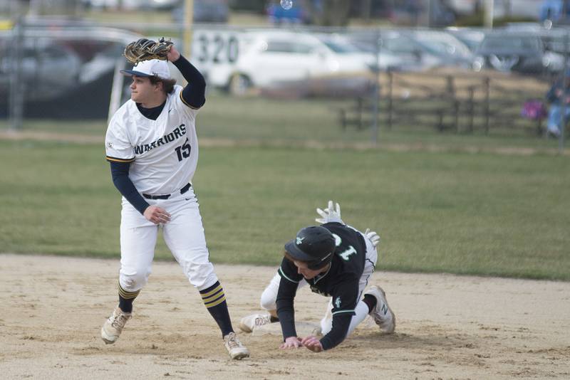 Sterling's Colt Adams holds up the ball after tagging out Alleman’s Chance Carruthers trying to steal second Tuesday, April 5, 2022.
