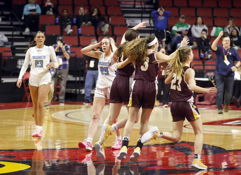 Nazareth Academy's Danielle Scully (23) and Amalia Dray (25) react after losing to Loyola Academy during the IHSA Class 4A Girls Basketball championship game Saturday, March 2, 2024 at the CEFCU Arena in Normal.