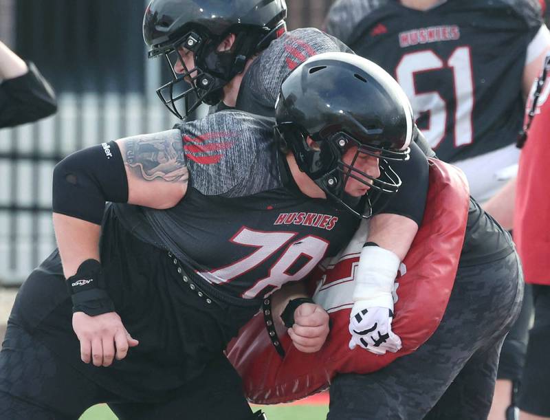 Northern Illinois University offensive lineman Jacob Welch throws a block Tuesday, April 14, 2026, during a drill at spring practice in Huskie Stadium at NIU in DeKalb.