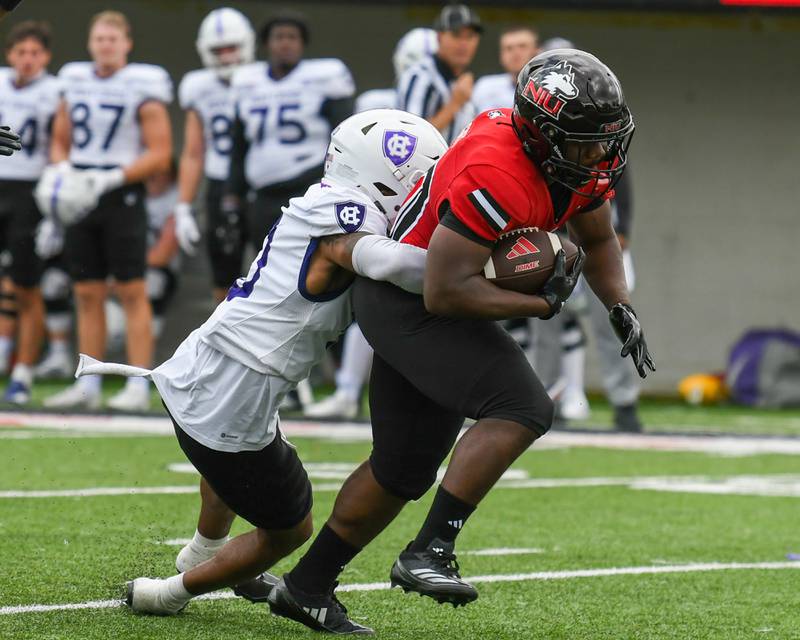 Northern Illinois University's running back Chavon Wright (10) gets a first down during the first half of the game before being tackled by Holy Cross on Saturday Aug. 30, 2025, held at Huskie Stadium in DeKalb.