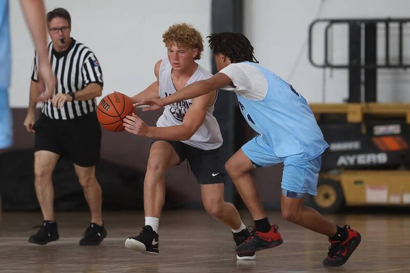 Morris’ Cade Laudeman takes the ball up-court against Plainfield South at the 37th Morris Boys Shootout on Tuesday, June 25, 2024.