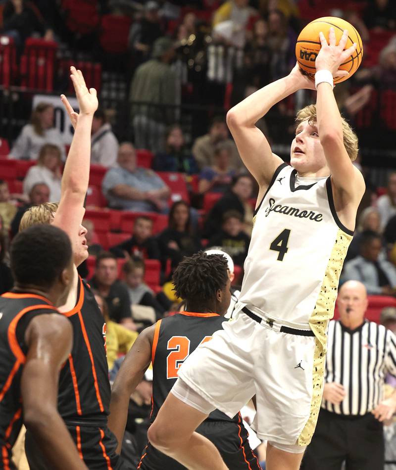 Sycamore's Isaiah Feuerbach shoots over DeKalb's Sean Reynolds during their game Friday, Jan. 31, 2025, in the FNBO Challenge in the Convocation Center at Northern Illinois University in DeKalb.