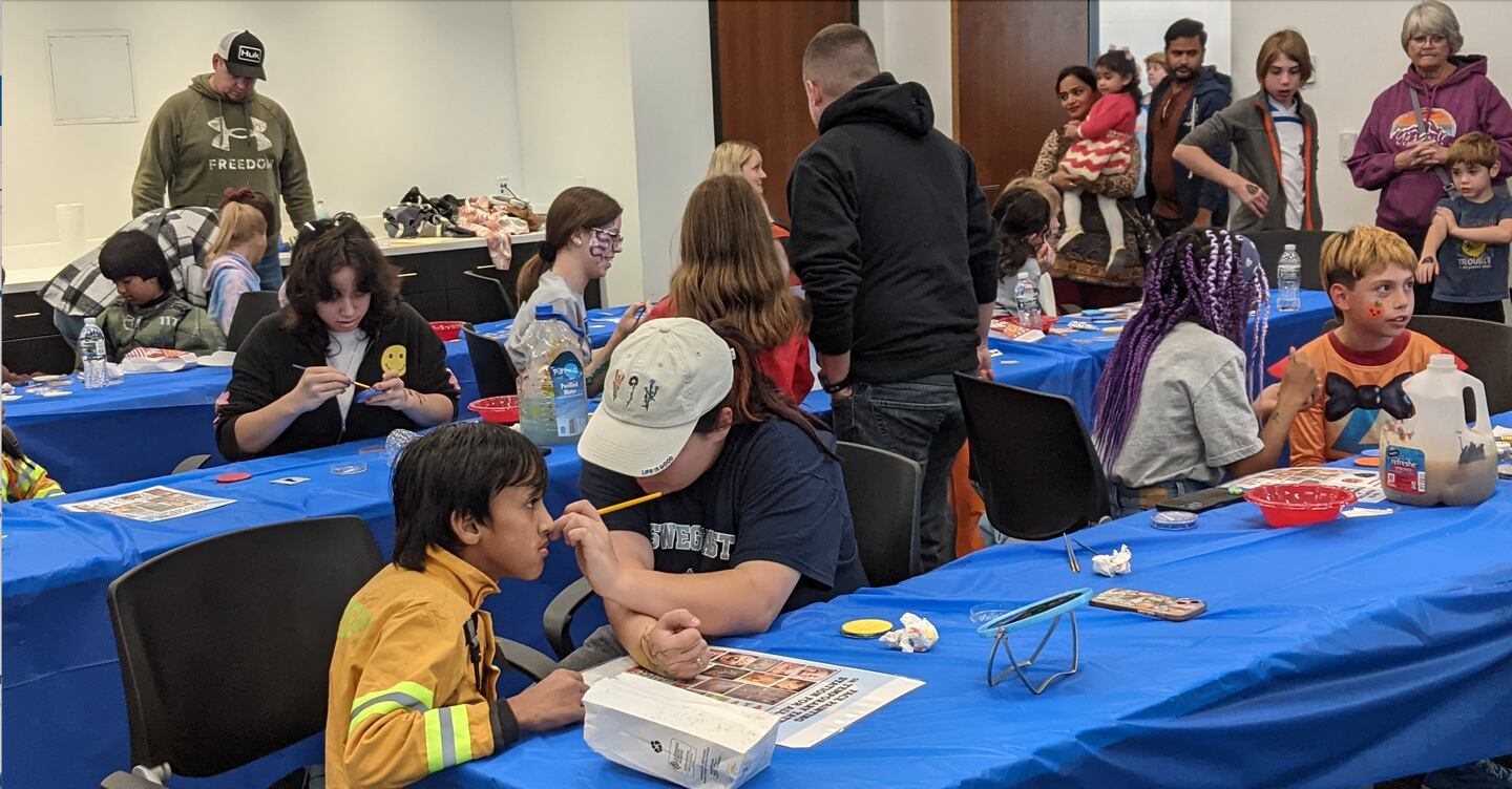 Children get their faces painted at the joint open house of the Oswego Fire Protection District and Oswego Police Department on Oct. 26.
