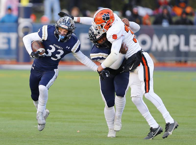 IC Catholic's Joey Gilatta (33) runs the ball during a Class 3A varsity football semi-final playoff game between Byron High School and IC Catholic Prep on Saturday, Nov. 19, 2022 in Elmhurst, IL.