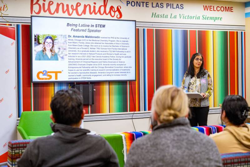 Dr. Sheela Vemu, associate professor of biology, welcomes guests to the 2022 Being Latine in STEM event at Waubonsee’s Aurora Downtown Campus Latinx Resource Center.
