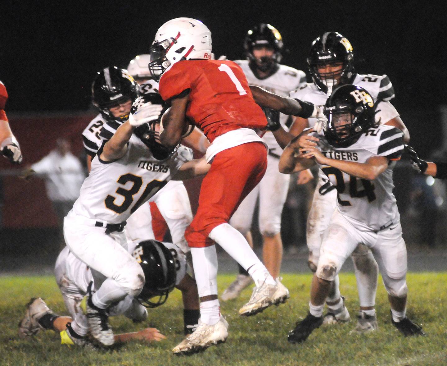 Streator's Isaiah Brown (1) tries to fend off Herscher's Gerritt Osenga (30) and Connor Massie-Devore at Doug Dieken Stadium on Friday, Sept. 22, 2023.