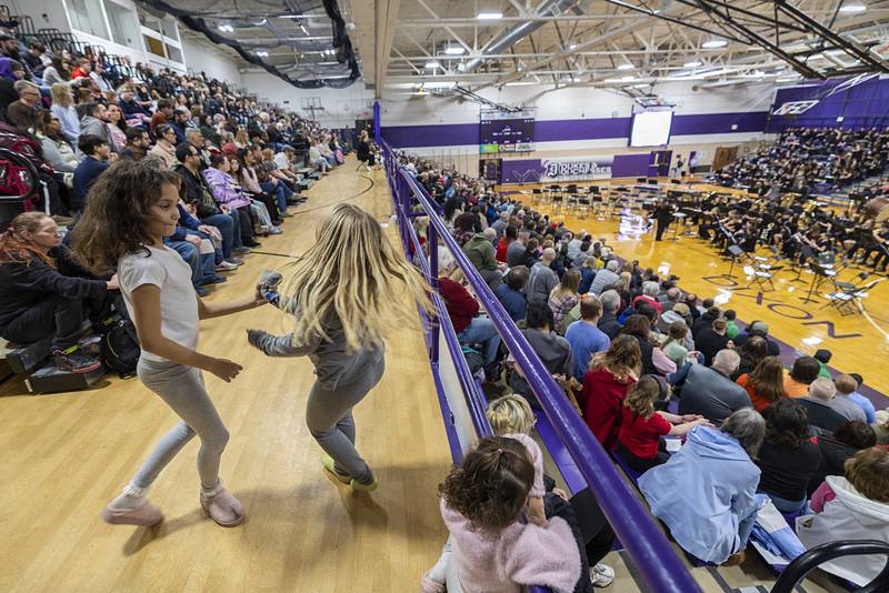 Girls dance to the Dixon High School band as they play a music selection from the Star Wars universe Friday, Feb. 13, 2026.