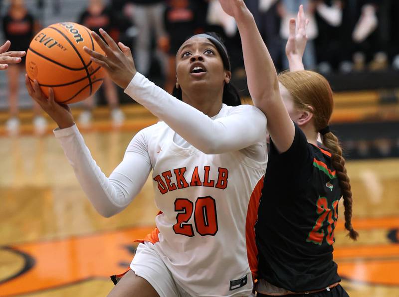 DeKalb's Zora Watts drives against Plainfield East's Heather Bunker Thursday, Feb. 12, 2026, during their game at DeKalb High School.