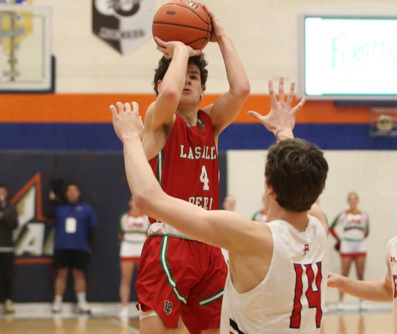 L-P's Brendan Boudreau takes a jump shot over Metamora's Luke Hopp during the Class 3A Sectional on Tuesday, Feb. 27, 2024 at Pontiac High School.