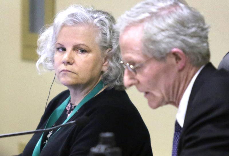 DeKalb City Clerk Lynn Fazekas listens while City Manager Bill Nicklas reads a proposed amendment to the city code Monday at the City Council meeting. The amendment would transform the office of city clerk to an appointed position rather than an elected office.