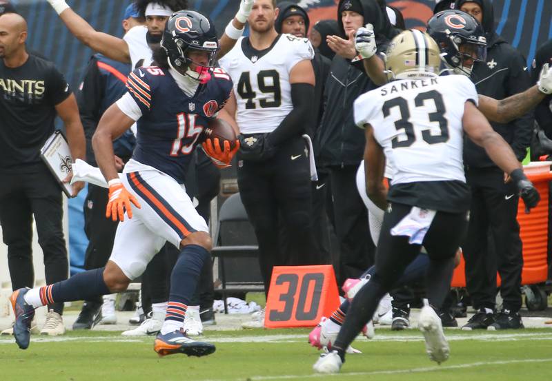 Chicago Bears wide receiver Rome Odunze runs down the sidelines as he is forced out of bounce by New Orleans Saints safety Jonas Sanker on Sunday, Oct. 19, 2025 at Soldier Field in Chicago.