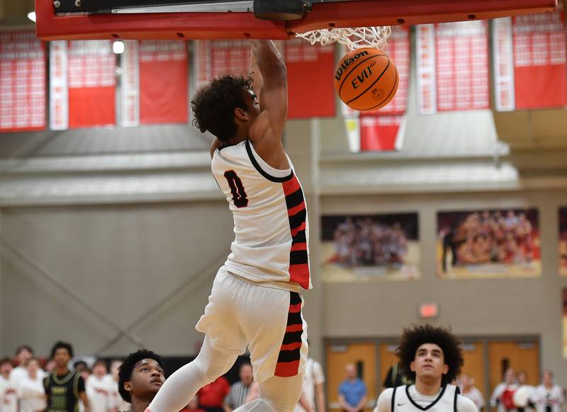 Benet’s Blake Fagbemi slam dunks the ball during a game against St. Patrick on January 17, 2025 at Benet Academy in Lisle.