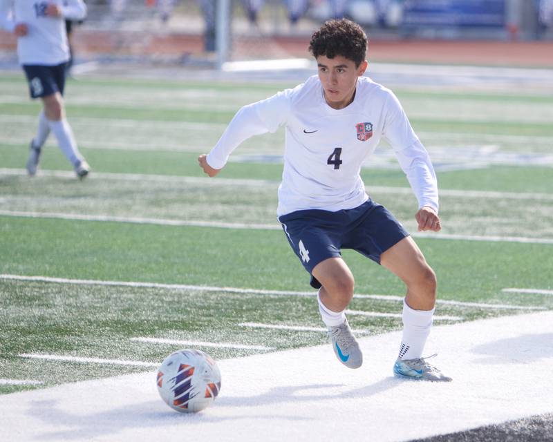 Conant's Aidan Hensgen looks to advance ball down field against Geneva at the Class 3A St. Charles North Sectional Final on Saturday, Nov.2,2024 in St. Charles.