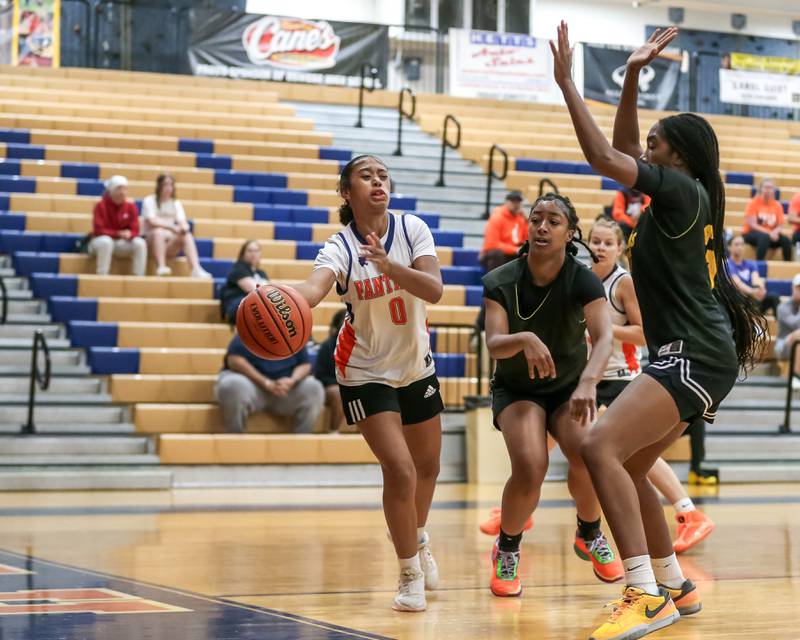 Oswego's Alexis Fomby makes a pass from underneath the basket at the Oswego girls basketball shootout tournament. June 28, 2024.