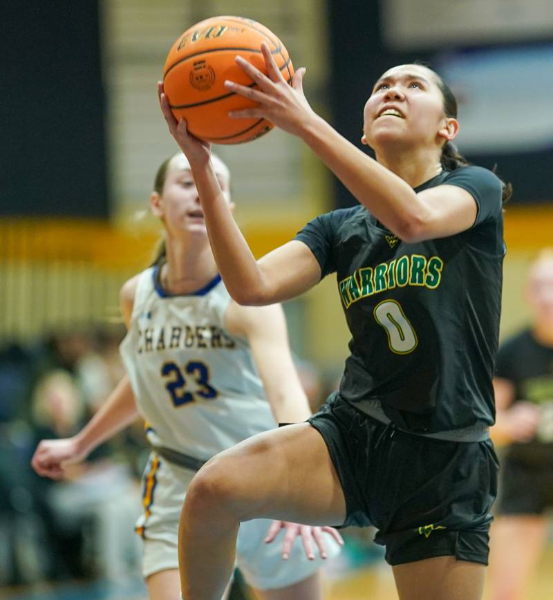 Waubonsie Valley's Maya Pereda (0) shoots the ball in the post agent Aurora Central Catholic's Riley Cwinski (23) during a basketball game at Aurora Central Catholic High School on Thursday, January 30, 2025.
