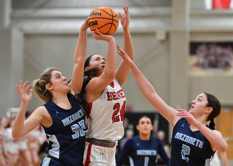 Nazareth’s Stella Sakalas (left) blocks a shot by Benet’s Emma Briggs as teammate Samantha Austin (2) screens her view during a game on January 29, 2025 at Benet Academy in Lisle.