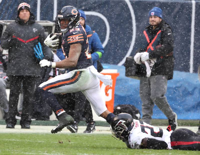 Chicago Bears running back Roschon Johnson pulls away from Atlanta Falcons safety Richie Grant during their game Sunday, Dec. 31, 2023, at Soldier Field in Chicago.