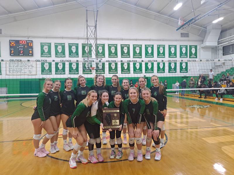 Providence Catholic's girls volleyball team celebrates after winning the Class 3A Providence Catholic Regional championship with a 25-10, 25-13 win over Crete-Monee on Thursday, Oct. 26, 2023 in New Lenox.