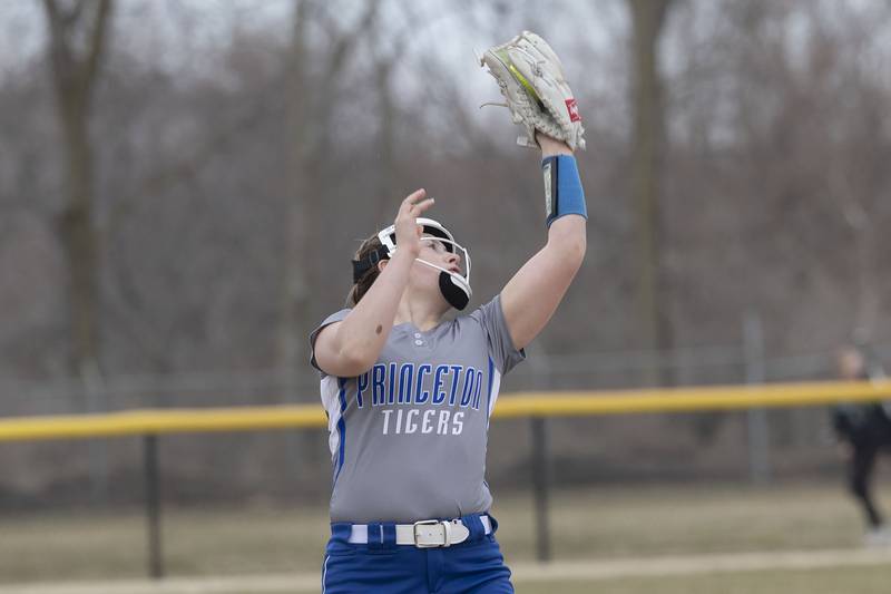 Princeton’s Izzy Gibson hauls in a pop fly at third base against Rock Falls Thursday, March 23, 2023.