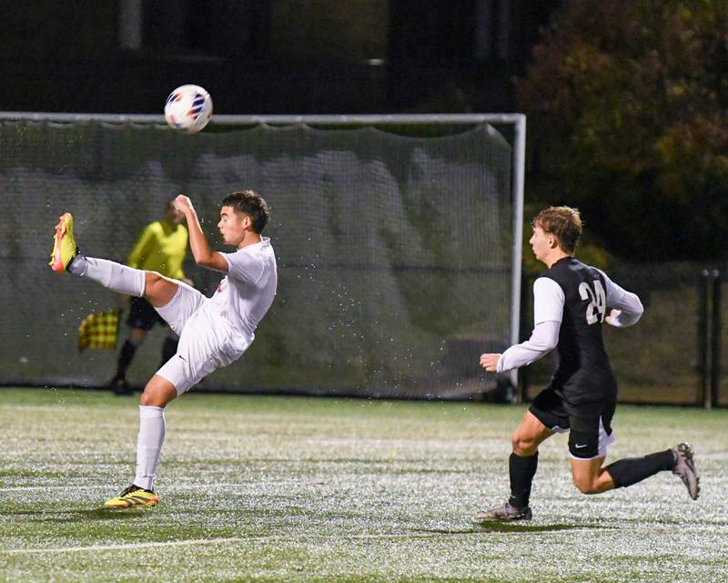 Benet' Academys Sergio Polanco (9) kicks the ball towards Prairie Ridge’s goal during the class 2A super sectional soccer match on Tuesday Nov. 5, 2024, held at Wheaton Academy in West Chicago.
