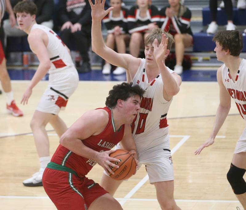 L-P's Josh Senica is stuck in the lane as he runs into Metamora's Cooper Koch during the Class 3A Sectional on Tuesday, Feb. 27, 2024 at Pontiac High School.