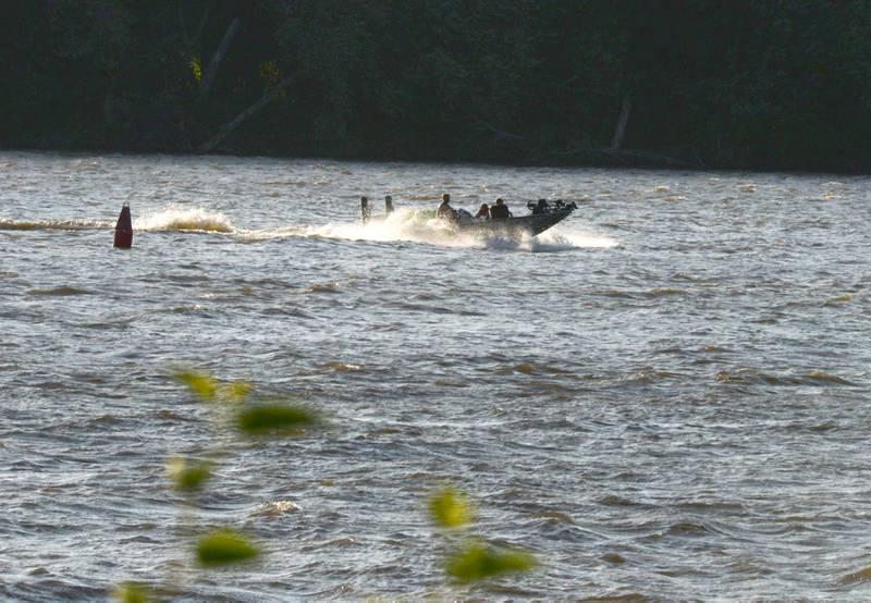 A boat travels on the Mississippi River near Albany on Saturday, June 21, 2025.