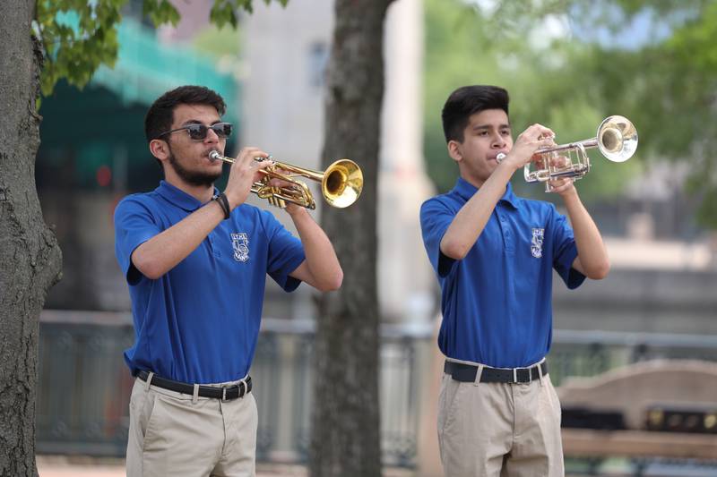 Joliet Central H.S. Band members Jeremy Lannan and Kevins Guzman performs Taps at a special Flag Day ceremony dedicating a memorial to remember the 28 World War II Submarines that traveled through Joliet on their way to the Pacific theater in Bicentennial Park on Wednesday, June 14, 2023 in Joliet.