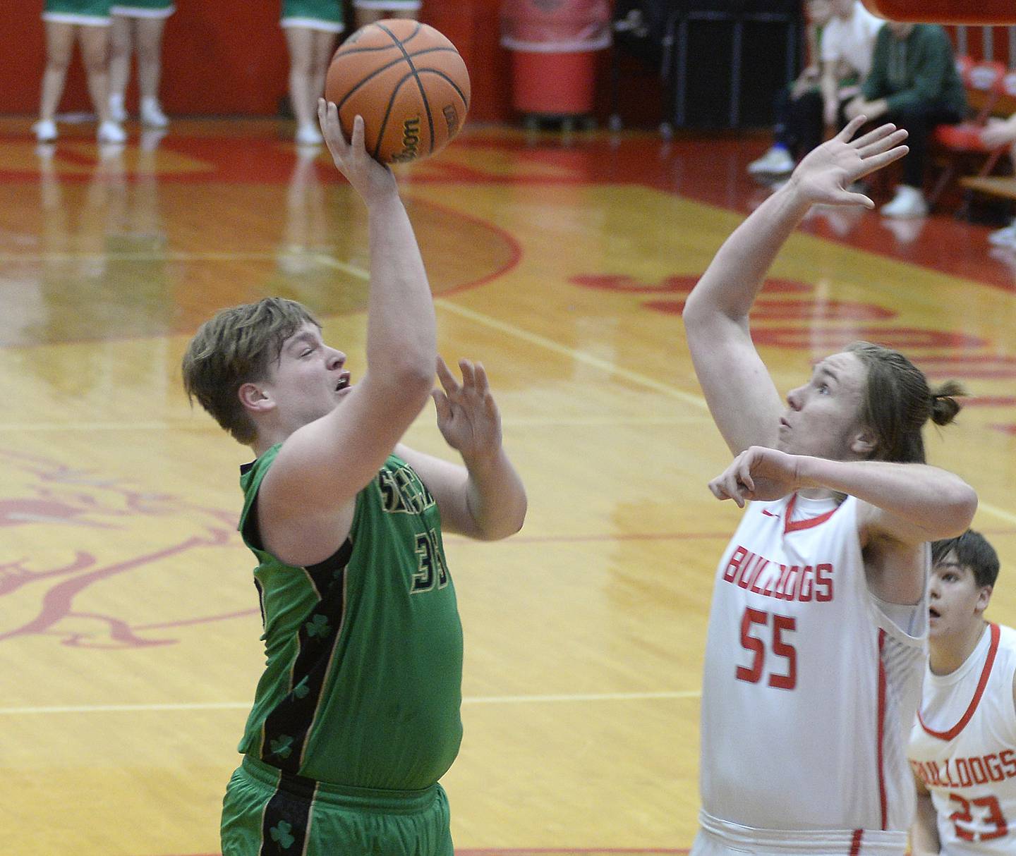 Seneca’s Josh Lucas shoots over the block attempt by Streator’s Quinn Baker in the 1st period in Pops Dale Gymnasium on Tuesday Feb. 7, 2023 at Streator High School.