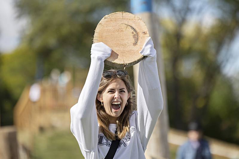 Maryland visitor Tori Davis shows off her consolation prize Saturday, Oct. 7, 2023 at the Rock Falls Tourism Lumberjack show.