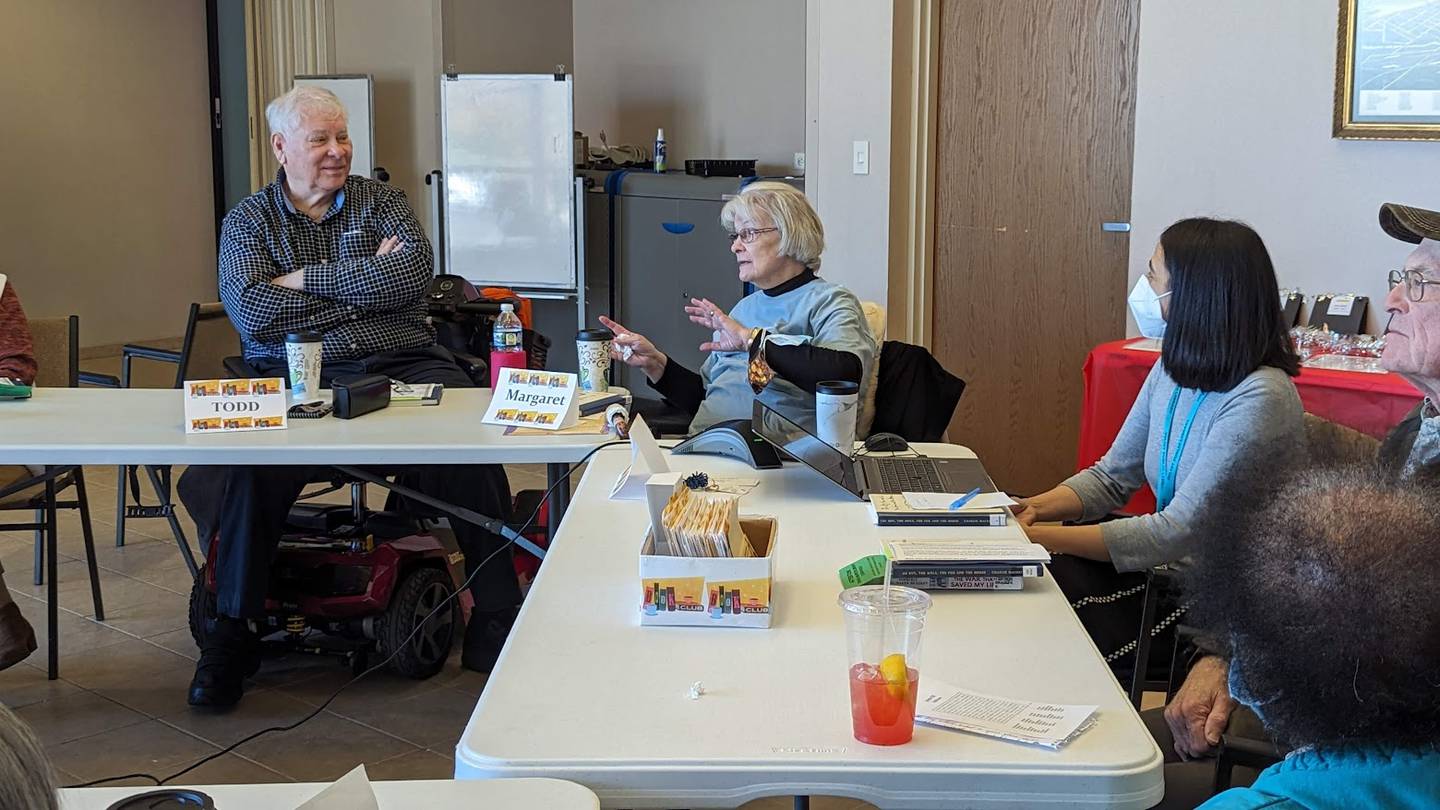 The Joliet Public Library Book Group celebrated its 25th anniversary on Tuesday with bakery from the Book and Bean Café at the Black Road branch, where book group meets. Pictured, from left, are members Todd Hogan of Joliet, longtime member Margaret Holzrichter of Joliet and Christine Maleno, adult services librarian at the Joliet Public Library and book group facilitator.