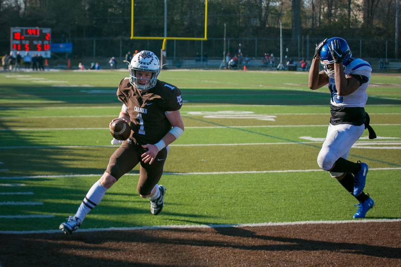 Phillips linebacker Jason Cannon (10) reacts as Mount Carmel quarterback Justin Lynch (1) runs in a touchdown in the second quarter during their Class 7A quarterfinal playoff game last season at Mount Carmel in Chicago.