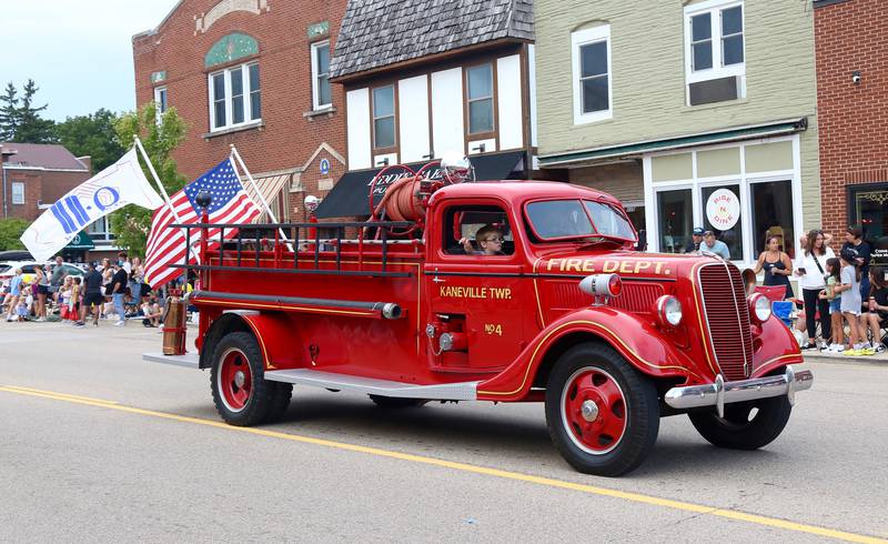 A vintage 1937 Ford Firetruck from the Kaneville Township Fire Department is driven down Main Street in the annual Elburn Days Parade on Friday, Aug. 16, 2024.
