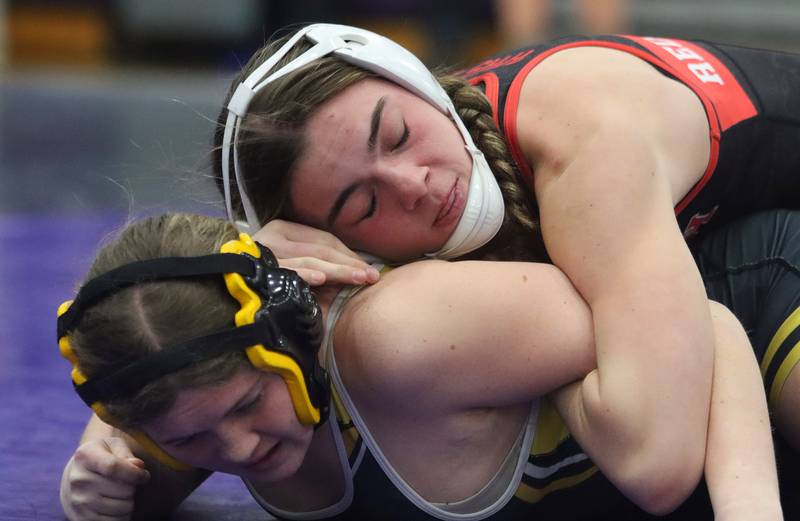 Huntley’s Aubrie Rohrbacher, top, controls Harvard’s Khloe Vest at 130 pounds in IHSA Regional wrestling semifinal action on Saturday, Feb. 1, 2025, at  Hampshire High School  in Hampshire.