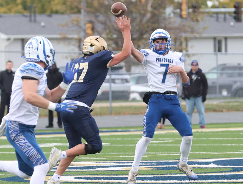 Princeton quarterback Gavin Lanham throws a pass intended to Casey Etheridge during the Class 3A playoffs on Saturday, Nov. 1, 2025 at Central Catholic High School in Bloomington.