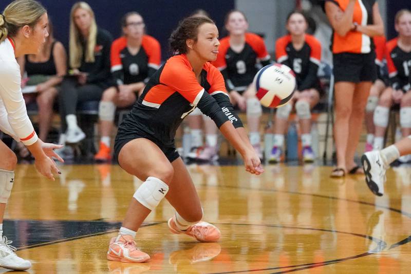 Minooka's Gabriella Sherman (2) sets the ball off a dig against Oswego East during a Southwest Prairie Conference match in Oswego on Thursday, Sept. 18, 2025.