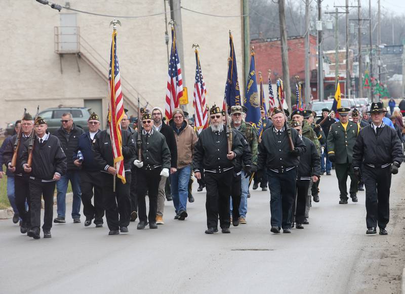 Veterans march down Water Street in the 44th annual Pearl Harbor parade and memorial ceremony on Saturday, Dec. 2, 2023 in Peru.