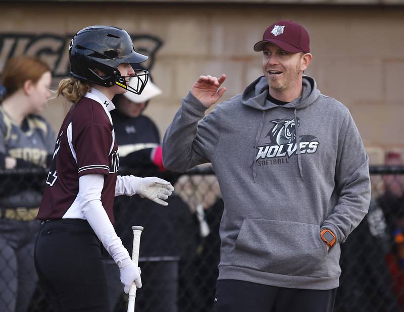 Prairie Ridge coach Scott Busam talks with Kylie Kemp during a nonconference softball game against Grayslake North Thursday. March 23, 2023, at Grayslake North High School.