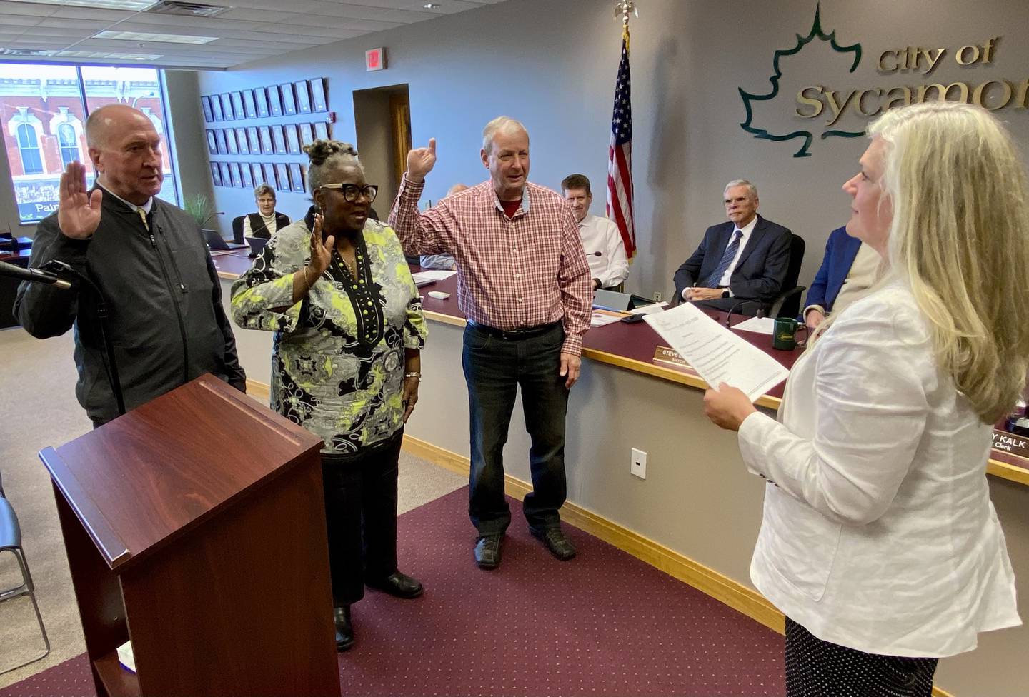 Sycamore City Council (from left) 3rd Ward Alderperson Marvin Barnes, 4th Ward Alderperson Virginia Sherrod and 1st Ward Alderperson Alan Bauer are sworn into office by Sycamore City Clerk Mary Kalk (right) on Monday, May 5, 2025, at the Sycamore City Center.