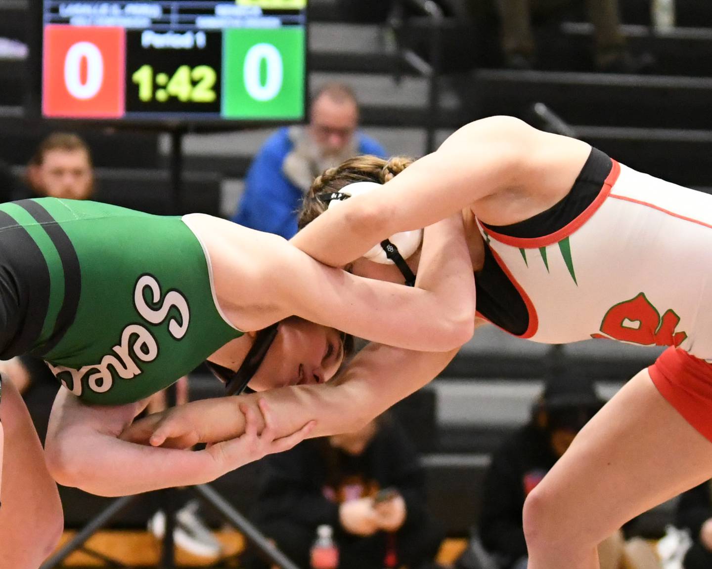 Seneca’s wrestler Samantha Greisen, left, competes against Lasalle-Peru’s Kiely Domyancich during the 125-pound weight class sectional championship match up on Saturday Feb. 14 ,2026, held at DeKalb High School.