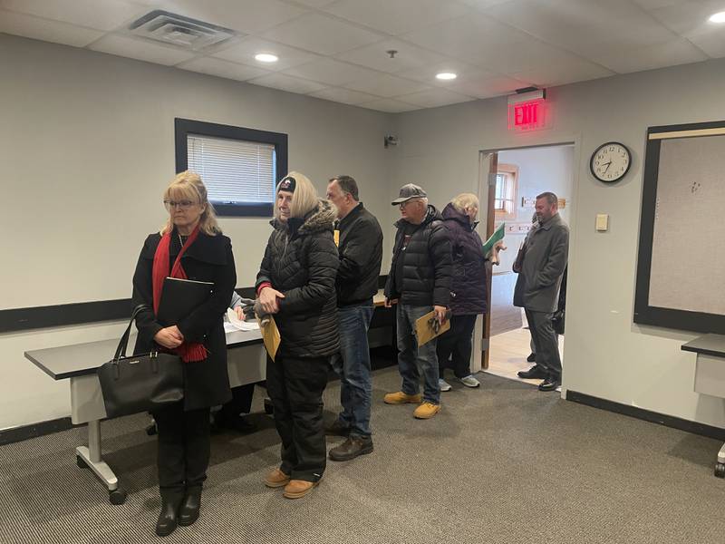 Candidates for elected office in DeKalb County stand in line to file petitions Nov. 27, 2023, at the DeKalb County Administrative Building in Sycamore.